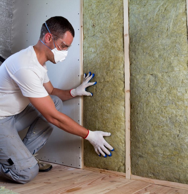 Worker,In,Protective,Goggles,And,Respirator,Insulating,Rock,Wool,Insulation